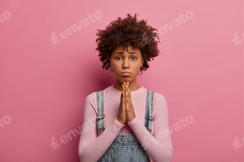 Preview: Please I Beg You. Sorrowful Dark Skinned Ethnic Woman Holds Hands In Pray, Asks For Apology Or