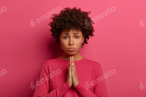 Preview: Pitty Miserable Woman With Afro Hairstyle Presses Palms Together, Begs For Favour, Has Innocent