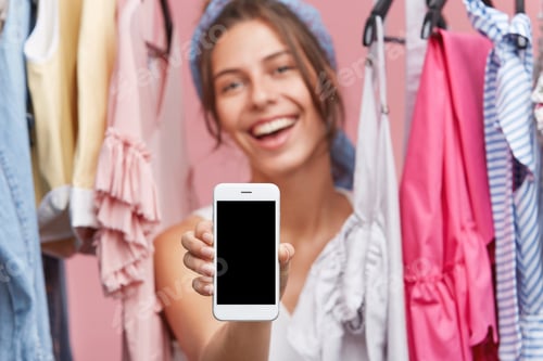 Preview: Modern White Smart Phone With Blank Screen For Your Advertisment Or Promotional Text In Woman`S