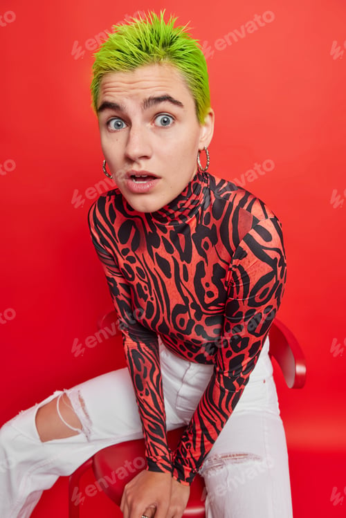 Preview: Shocked Green Haired Punk Girl Stares With Widen Eyes Holds Breath From Amazement Wears Casual