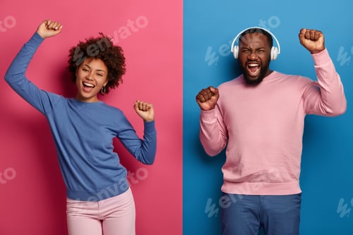 Preview: Black Woman And Man Feel Amused, Entertained Dance Together, Keep Arms Raised Up, Have Carefree