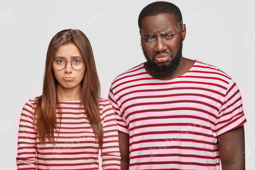 Preview: Interracial Relationship Concept. Displeased Dark Skinned Guy And His Girlfriend Being Discontent