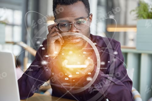 Preview: Serious Businessman Has Dark Skin, Looks At His Smart Phone With Infographic Interface, Wears