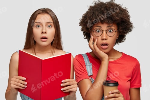 Preview: Stupefied Emotional Surprised Students Have Puzzled Look At Camera, Hold Textbook And Take Out