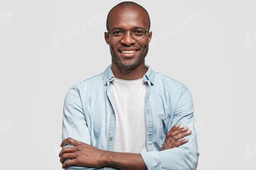 Preview: Horizontal Shot Of Prosperous Businessman Keeps Hands Crossed, Has Satisfied Expression, Looks