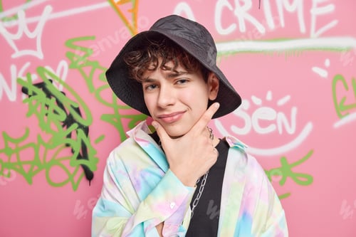 Preview: Thoughtful Cool Hipster Guy Holds Chin Considers Something Has Displeased Expression Wears Hat And