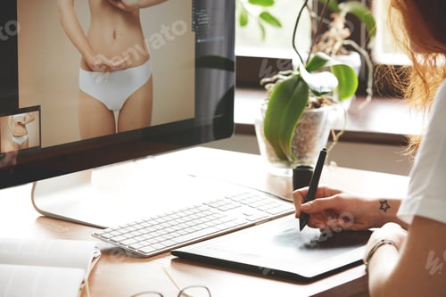 Preview: Close-Up Of Female Hands Retouching Photos Using Digital Tablet. Cropped Portrait Of Young Woman