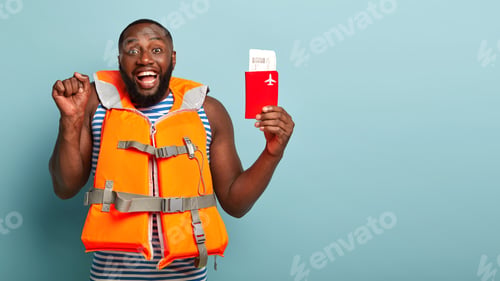 Preview: Man Wearing Life Vest Holding Passport and Ticket