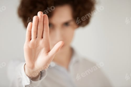 Preview: Close Up Isolated Shot Of Woman With Short Brunette Hair Making Stop Gesture With Her Hand. Female