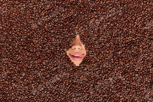 Preview: Human Face Covered With Roasted Coffee Beans. Unrecognizable Woman Sticks Nose And Mouth Through