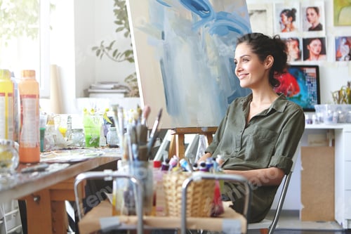 Preview: Indoor Shot Of Charming Cheerful Young European Female Art Teacher With Dark Curly Hair And Cute