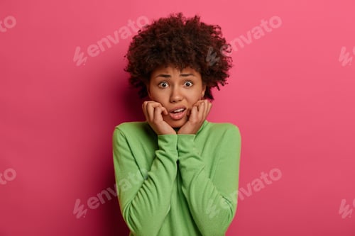 Preview: Photo Of Worried Nervous Woman Looks Puzzled, Afraids Of Saying Something, Dressed In Casual Wear