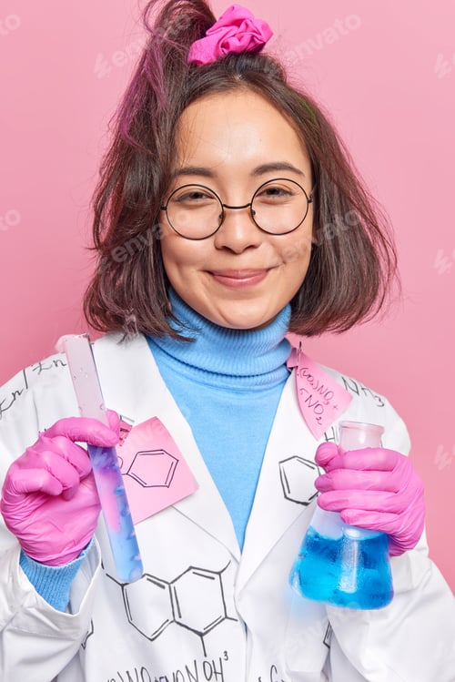 Preview: Chemist Works On Science Experiment Makes Pharmaceutical Research Holds Glass Tube And Beaker With