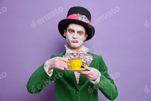 Preview: Bored Displeased Man Hatter Obsessed With Drinking Tea Wears Big Hat Green Costume Bowtie Poses