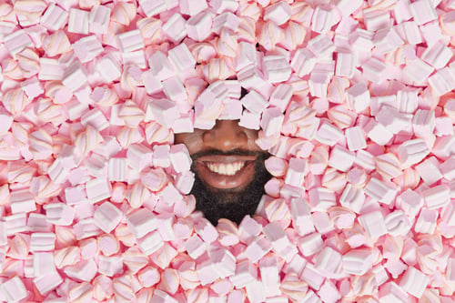 Preview: People Food Confectionery Concept. Unrecognizable Cheerful Man With Dark Skin And Beard Sticks