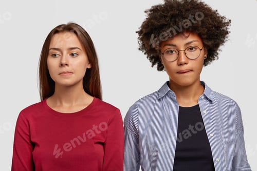 Preview: Indoor Shot Of Contemplative Mixed Race Women Purse Lips, Being Deep In Thoughts, Have Sad