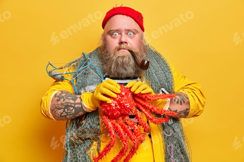 Preview: Stupefied Bearded Sailor Holds Big Octopus And Smokes Pipe Poses With Fishing Net Around Neck Has