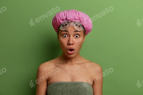 Preview: Stupefied Female Stares With Widely Opened Eyes And Mouth, Has Shocked Reaction On Something, Wears