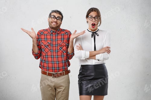 Preview: People And Body Language Concept. Uncertain Male Nerd Shrugs Shoulders, Has Doubts Stands Next To