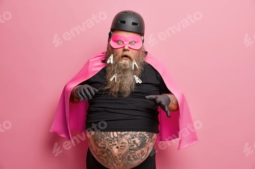 Preview: Surprised Emotive Bearded Man Reacts On Something Scarying Raises Hand Keeps Mouth Opened Wears