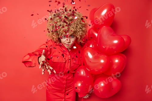 Preview: Annoyed Woman Doesnt Like Surprise Received On Birthday Wears Dress Holds Bunch Of Heart Balloons