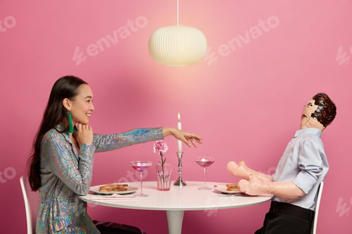 Preview: Cheerful Woman In Festive Clothes Stretches Hand Over Table To Imaginary Husband Or Boyfriend