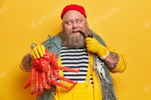 Preview: Thoughtful Pleased Boatswain Smokes Pipe And Concentrated Aside Happy To Catch Octopus At Sea Wears