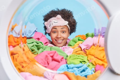 Vista previa: Daily Routine Concept. Cheerful Young African American Woman With Only Head Shown Wears Sleepmask