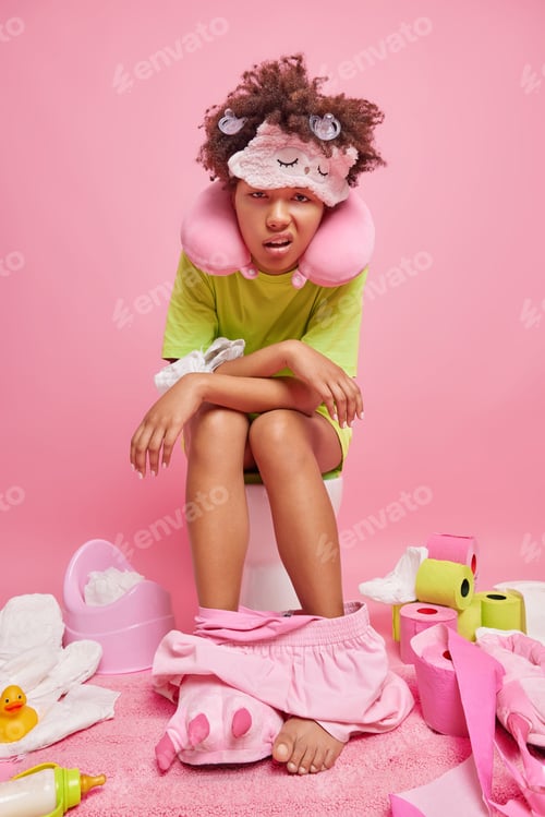 Preview: Unhappy Discontent Young African American Woman Suffers From Abdominal Pain Wears Sleepmask Neck