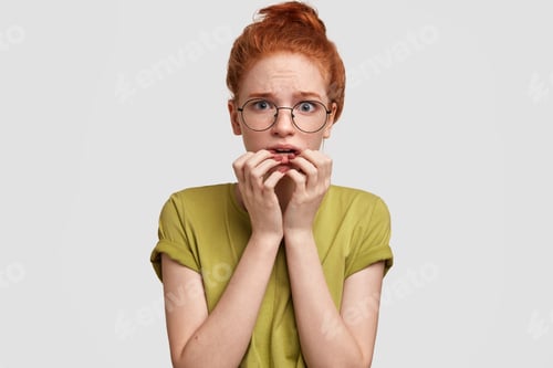 Preview: Impressed Nervous Female With Ginger Hair, Feels Stressed And Embarrassed As Finds Out Bad