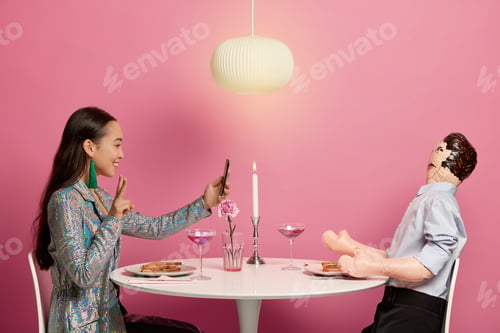 Preview: Happy Elegant Woman Takes Selfie On Modern Cellphone, Makes Peace Gesture, Has Romantic Date On