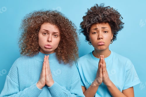 Preview: Two Guilty Women With Curly Hair Keep Palms Pressed Together Have Pleading Angel Innocent