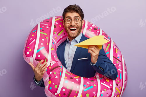 Preview: Happy Successful Employer Rejoices Coming Annual Leave, Holds Paper Airplane, Poses In Inflated