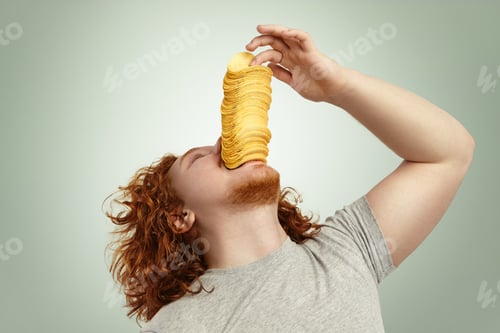 Preview: Indoor Shot Of Overweight Young Bearded Male With Red Curly Hair Throwing Head Back, Performing