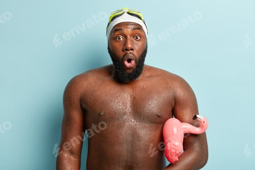 Preview: Photo Of Astonished Black Man With Wet Skin, Shocked To See Many People At Beach, Swims In Sea With