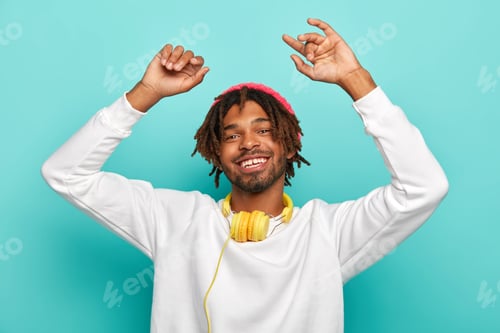 Preview: Carefree Happy Hipster Listens Music In Modern Headset, Raises Arms And Dances Joyfully, Feels