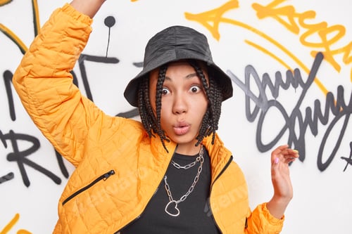 Preview: Surprised Tagger Raises Arms Over Graffiti Wall Dances To Favorite Music Wears Fashionable Yellow