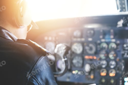 Preview: People, Lifestyle And Occupation Concept. Rear View Of Commercial Pilot Wearing Headset And Uniform