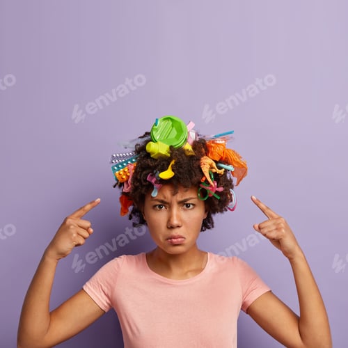 Preview: Dissatisfied Angry Afro Woman Being Eco Friendly, Points At Curly Hair Full Of Harmful Products