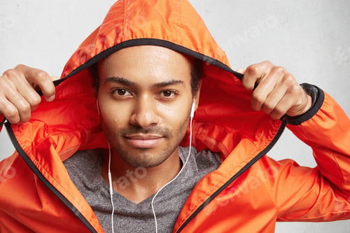 Preview: Young Active Mixed Race Man With Dark Skin And Stubble, Being Wet After Going In For Sport On Rainy