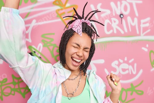 Preview: Overjoyed Hipster Girl Dark Skinned Has Combed Braids Foolishes Around Laughs And Dances Poses