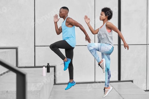 Preview: Motivated Active Ethnic Couple Run Up Stairs Together, Jump Highly, Train Climbing Staircase In