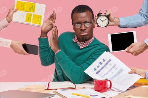 Preview: African American Dissatisfied Office Worker Shows Refusal Gesture, Asks Not Bother Him With Paper