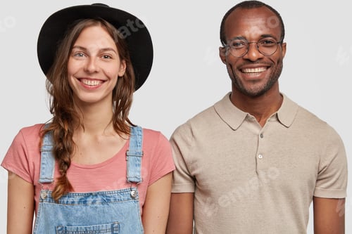 Preview: Horizontal Shot Of Multiethnic Woman And Man Stand Together Against White Background, Smile