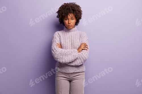 Preview: Serious African American Woman Looks With Self Assured Facial Expression, Keeps Arms Crossed Over
