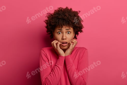 Preview: Anxious Vexed Woman Looks With Panic And Worry, Keeps Hands Near Opened Mouth, Trembles Nervously