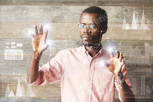 Preview: Young African American Office Worker Navigating Futuristic Touchscreen, Touching Glowing Icons