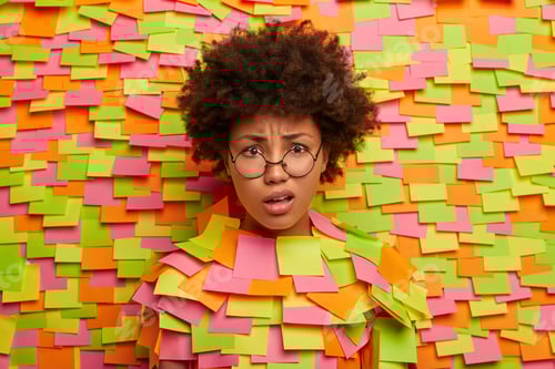 Preview: Close Up Shot Of Indignant Dissatisfied Dark Skinned Woman Smirks Face, Hears Puzzled Bad News