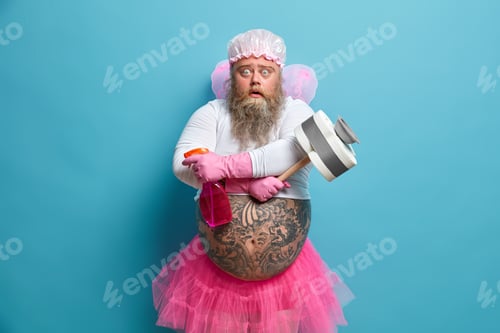 Preview: Shocked Embarrassed Cleaning Man Wears Hat Undersized T Shirt And Pleated Skirt Wings On Back