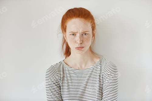Preview: Pretty Girl With Ginger Hair, Gathered In Ponytail Pouting Her Lips, Looking At Camera With